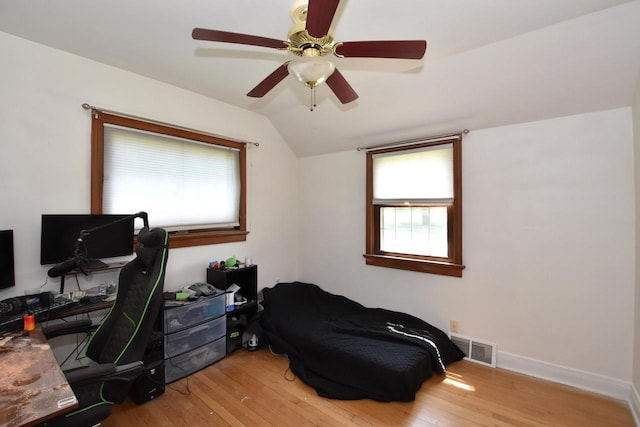 10526 W Congress St, Wauwatosa, WI 53225 - bedroom with multiple windows, light wood-type flooring, an office area, and lofted ceiling