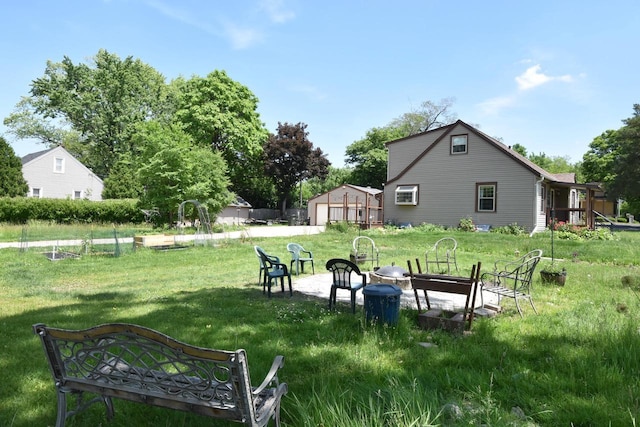 10526 W Congress St, Wauwatosa, WI 53225 - view of grassy yard featuring an outdoor fire pit