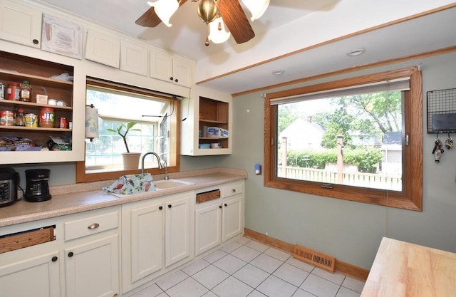 10526 W Congress St, Wauwatosa, WI 53225 - kitchen featuring open shelves, healthy amount of natural light, light countertops, and a ceiling fan