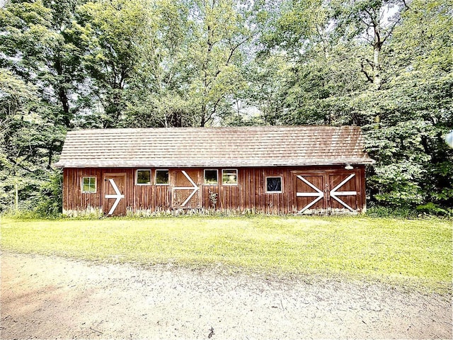 12830 Thunder Hollow Rd, Whitelaw, WI 54247 - view of barn with a yard