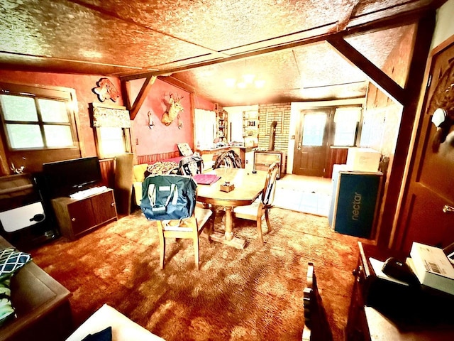 12830 Thunder Hollow Rd, Whitelaw, WI 54247 - dining area with vaulted ceiling and carpet flooring