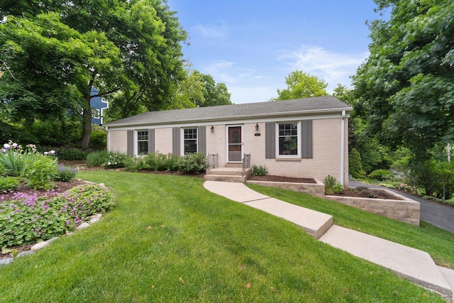 1060 Hawthorne Ln, Brookfield, WI 53005 - ranch-style home with brick siding and a front yard