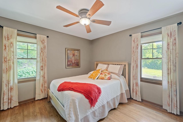 1060 Hawthorne Ln, Brookfield, WI 53005 - bedroom with wood finished floors and a ceiling fan