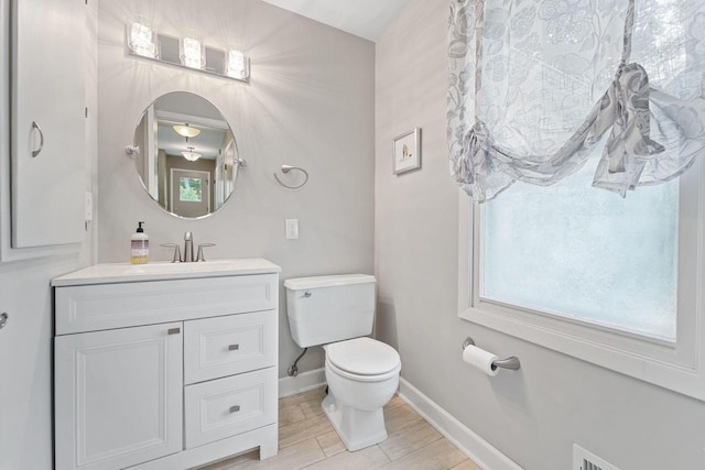 1060 Hawthorne Ln, Brookfield, WI 53005 - bathroom with vanity and wood tiled floors