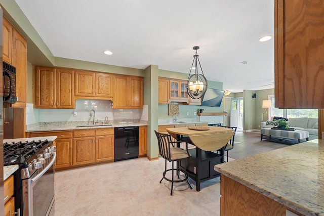 1060 Hawthorne Ln, Brookfield, WI 53005 - kitchen with black appliances, decorative backsplash, brown cabinetry, light stone countertops, and decorative light fixtures