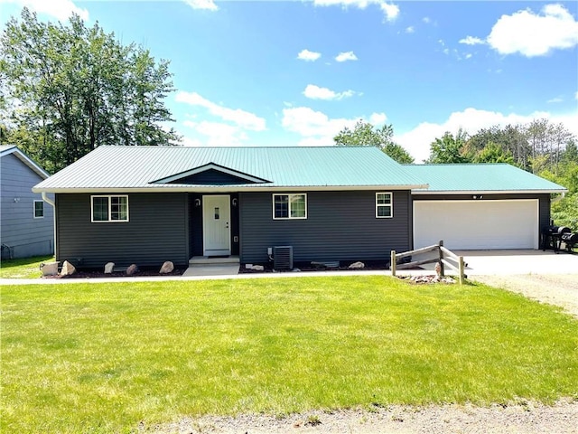 6782 55th St, Chippewa Falls, WI 54729 - single story home with a front lawn, a garage, driveway, and a metal roof
