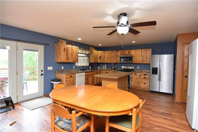 6782 55th St, Chippewa Falls, WI 54729 - kitchen featuring stainless steel appliances, a kitchen island, ceiling fan, wood finished floors, and recessed lighting