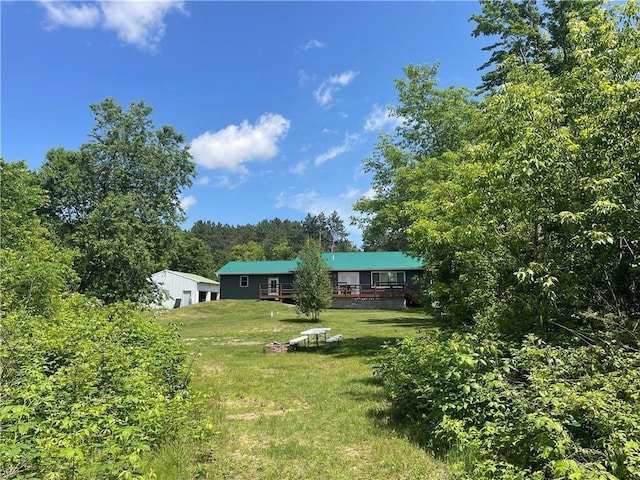 6782 55th St, Chippewa Falls, WI 54729 - view of grassy yard with a deck