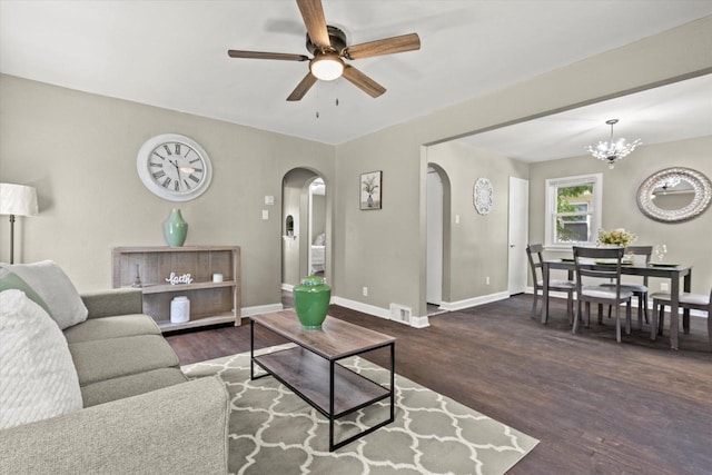 4455 N 58th St, Milwaukee, WI 53218 - living area with arched walkways, a ceiling fan, wood finished floors, and a chandelier