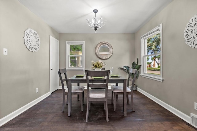 4455 N 58th St, Milwaukee, WI 53218 - dining area featuring a chandelier, plenty of natural light, and wood finished floors