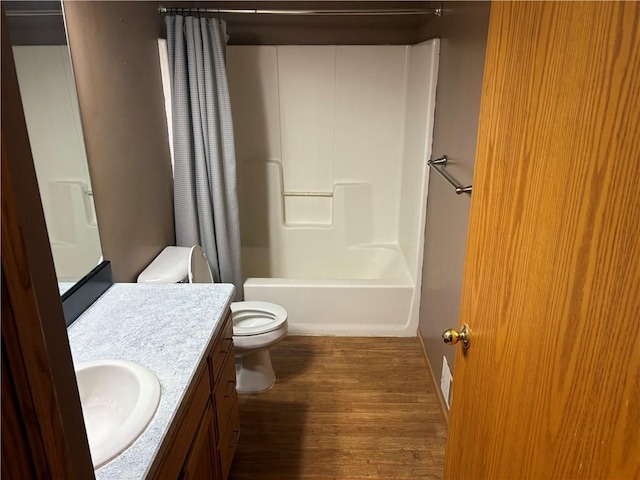 1430 5th Ave, Baldwin, WI 54002 - bathroom featuring vanity, wood finished floors, and shower / bath combo with shower curtain