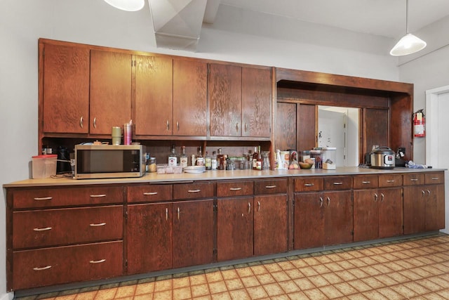 210 N 2nd St, Palmyra, WI 53156 - kitchen featuring stainless steel microwave, light flooring, and light countertops