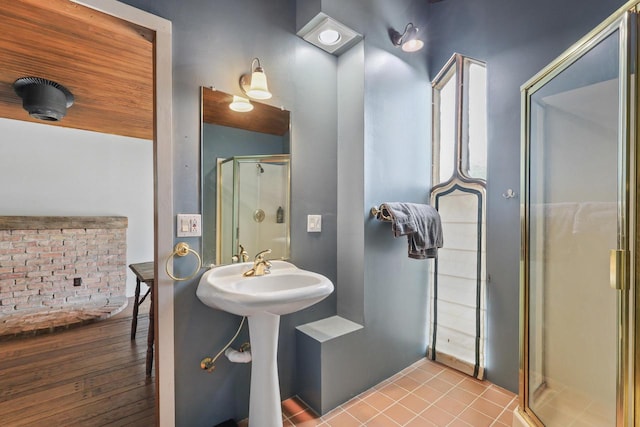 210 N 2nd St, Palmyra, WI 53156 - bathroom featuring a shower stall and wood finished floors