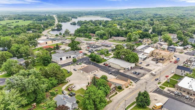 210 N 2nd St, Palmyra, WI 53156 - drone / aerial view of a nearby body of water and a heavily wooded area