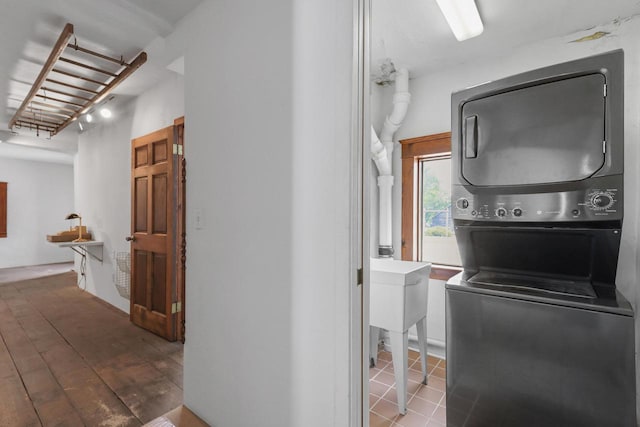 210 N 2nd St, Palmyra, WI 53156 - laundry area featuring stacked washer / dryer and wood finished floors
