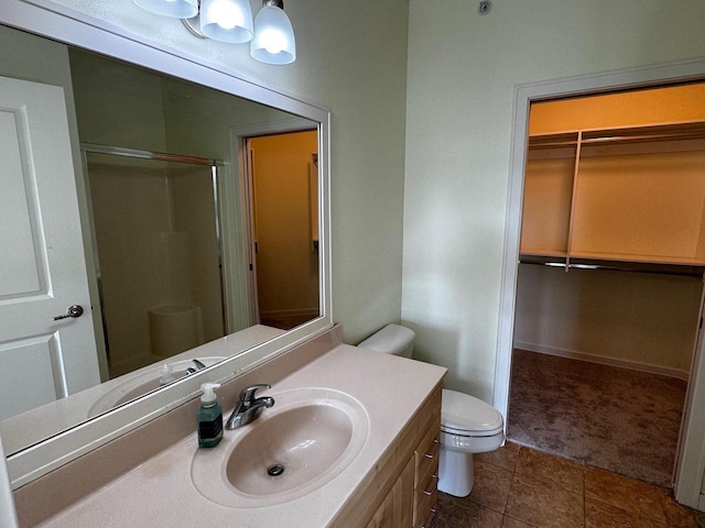 5196 Sassafras Dr Unit 313, Fitchburg, WI 53711 - bathroom featuring a stall shower, vanity, and a walk in closet