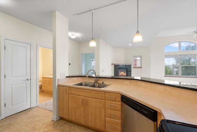 5196 Sassafras Dr Unit 313, Fitchburg, WI 53711 - kitchen featuring dishwasher, hanging light fixtures, a glass covered fireplace, and open floor plan