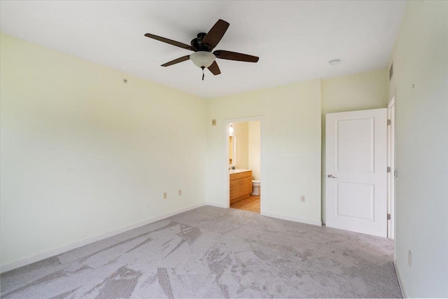 5196 Sassafras Dr Unit 313, Fitchburg, WI 53711 - unfurnished bedroom featuring light carpet, ensuite bathroom, and a ceiling fan