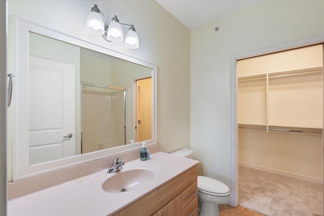 5196 Sassafras Dr Unit 313, Fitchburg, WI 53711 - bathroom featuring a shower stall, vanity, and a spacious closet