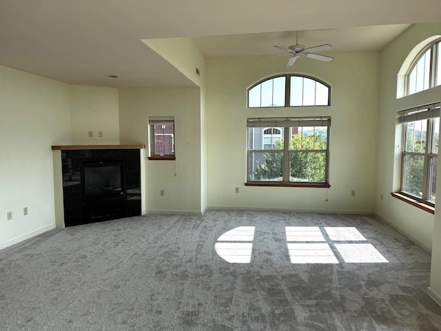5196 Sassafras Dr Unit 313, Fitchburg, WI 53711 - unfurnished living room with carpet, a glass covered fireplace, and ceiling fan