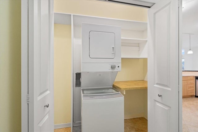 5196 Sassafras Dr Unit 313, Fitchburg, WI 53711 - laundry area with stacked washer / drying machine and baseboards