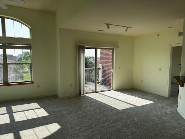 5196 Sassafras Dr Unit 313, Fitchburg, WI 53711 - carpeted spare room with track lighting and ceiling fan