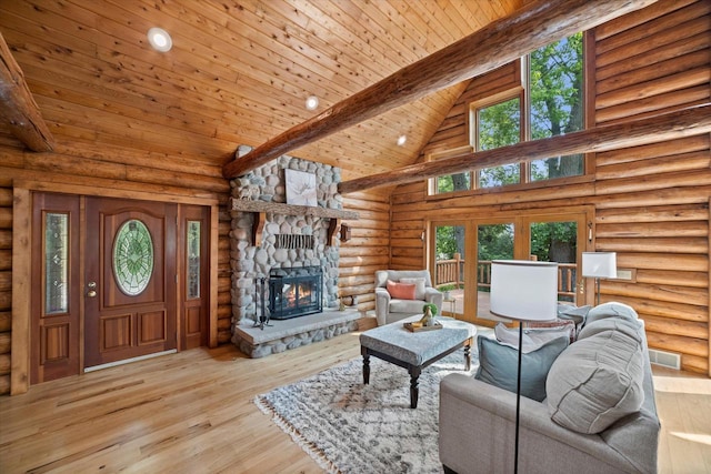5633 Contour Rd, Waterford, WI 53185 - living room with high vaulted ceiling, a fireplace, log walls, light wood-type flooring, and a wood ceiling with exposed beams
