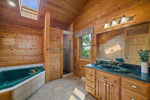 5633 Contour Rd, Waterford, WI 53185 - full bathroom with vaulted ceiling, a stall shower, wooden walls, a whirlpool tub, and a skylight
