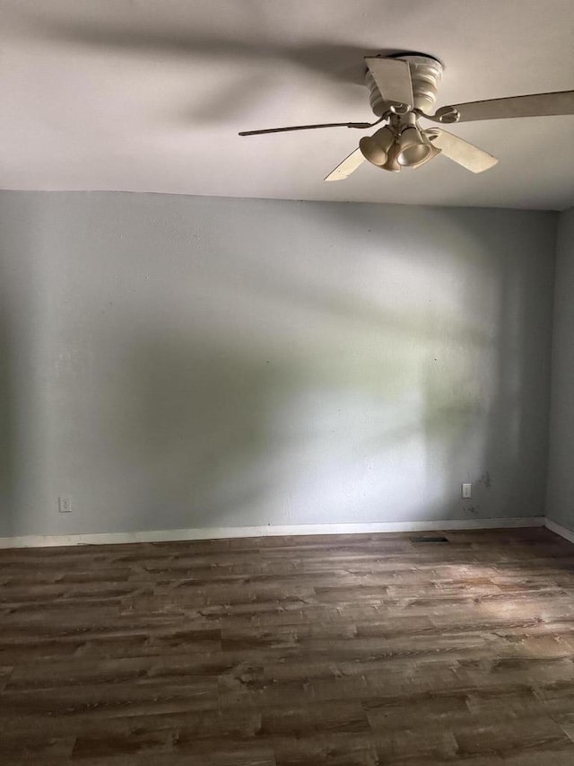 2340 N 12th St, Milwaukee, WI 53206 - spare room with dark wood finished floors and ceiling fan