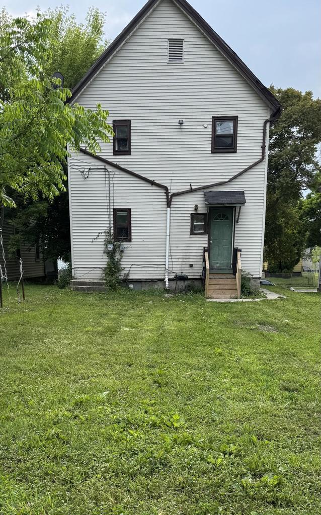 2340 N 12th St, Milwaukee, WI 53206 - rear view of house featuring entry steps and a yard