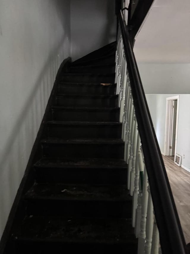 2340 N 12th St, Milwaukee, WI 53206 - stairs featuring wood finished floors