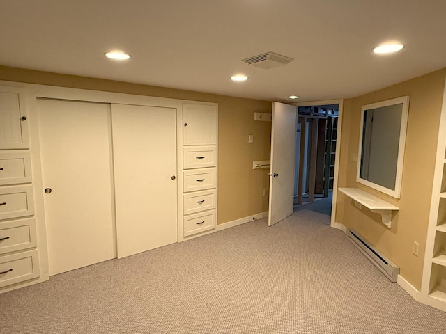 N72W14281 Good Hope Rd, Menomonee Falls, WI 53051 - unfurnished bedroom with a baseboard heating unit, light colored carpet, recessed lighting, and a closet