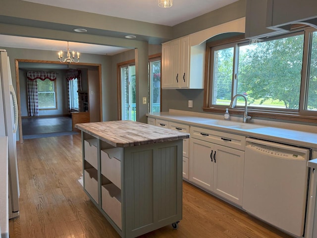 N72W14281 Good Hope Rd, Menomonee Falls, WI 53051 - kitchen featuring white appliances, white cabinetry, light wood-style floors, plenty of natural light, and recessed lighting