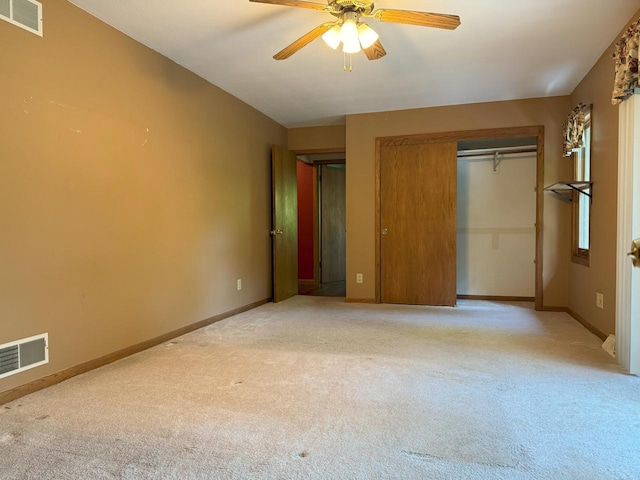N72W14281 Good Hope Rd, Menomonee Falls, WI 53051 - unfurnished bedroom with light colored carpet, two closets, and a ceiling fan