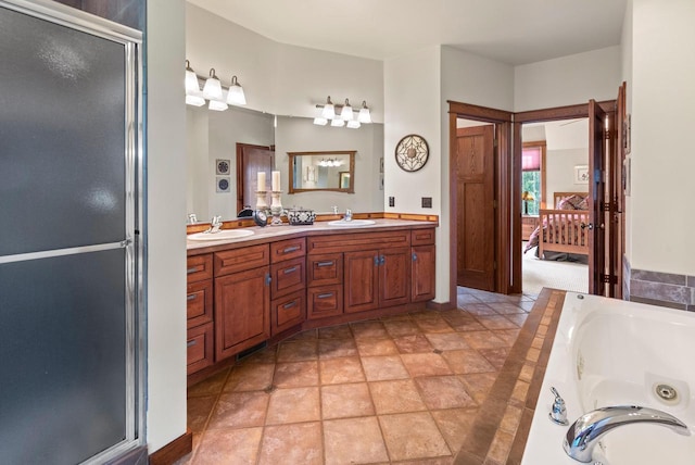 4570 Stoney Creek Rd, West Bend, WI 53095 - ensuite bathroom featuring double vanity, a jetted tub, and a shower stall