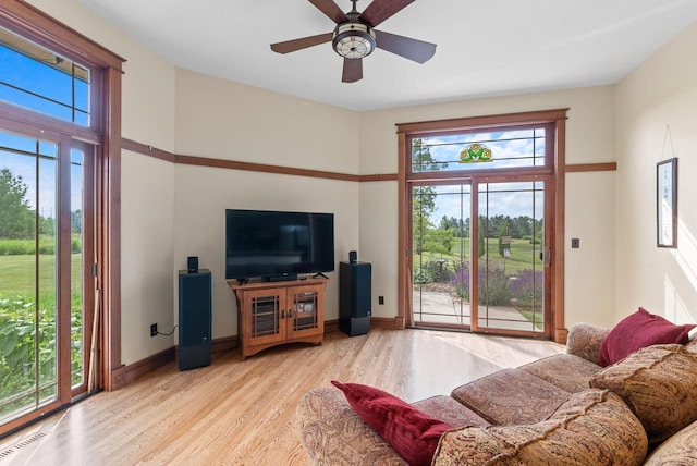 4570 Stoney Creek Rd, West Bend, WI 53095 - living area with light wood finished floors and ceiling fan