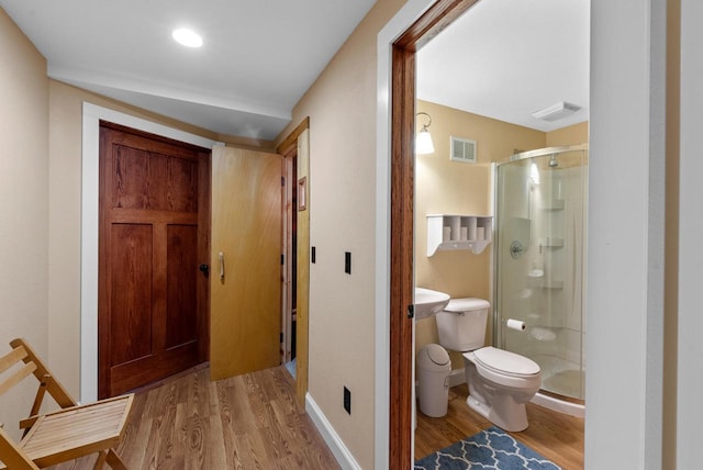 4570 Stoney Creek Rd, West Bend, WI 53095 - bathroom featuring wood finished floors and a stall shower