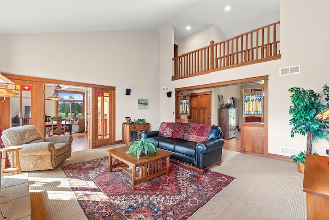 4570 Stoney Creek Rd, West Bend, WI 53095 - living area with high vaulted ceiling, carpet floors, and recessed lighting