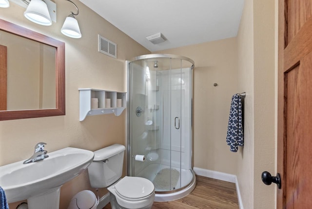 4570 Stoney Creek Rd, West Bend, WI 53095 - bathroom with wood finished floors and a stall shower