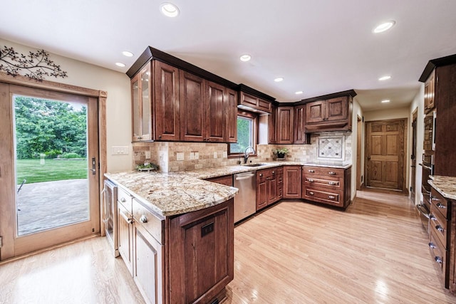 14240 Radiant Ct, Brookfield, WI 53005 - kitchen with stainless steel appliances, light wood-style floors, light stone counters, backsplash, and dark brown cabinetry