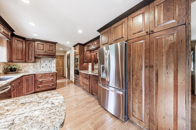 14240 Radiant Ct, Brookfield, WI 53005 - kitchen with stainless steel appliances, light stone countertops, light wood-style flooring, tasteful backsplash, and recessed lighting
