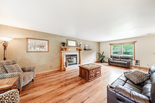 14240 Radiant Ct, Brookfield, WI 53005 - living room featuring light wood-style floors and a tile fireplace