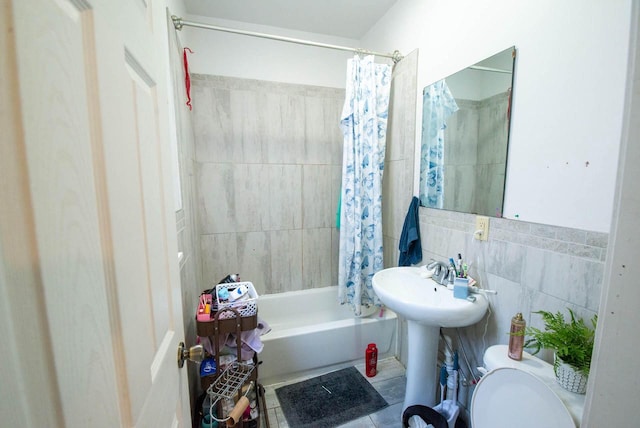 2110 54th St, Kenosha, WI 53140 - bathroom featuring tile walls, shower / tub combo, and tile patterned floors