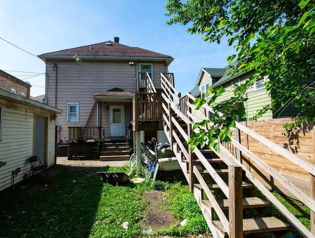 2110 54th St, Kenosha, WI 53140 - back of house with stairway and a wooden deck