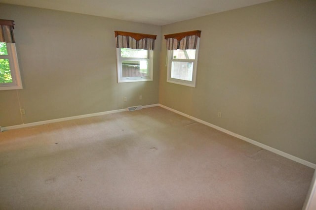 3333 N 12th St, Wausau, WI 54403 - spare room featuring light carpet and baseboards