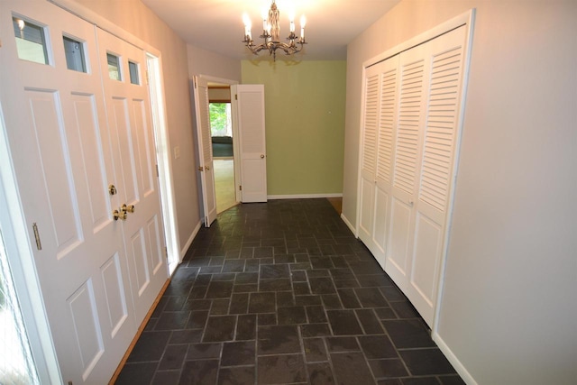 3333 N 12th St, Wausau, WI 54403 - hallway featuring brick patterned floors and a chandelier