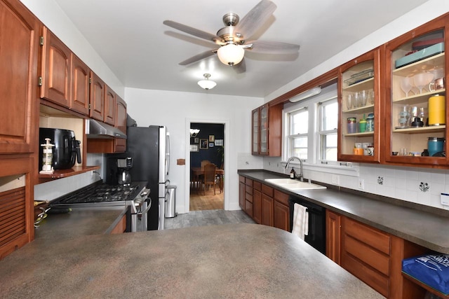 1032 Russet St, Racine, WI 53405 - kitchen featuring stainless steel range with gas stovetop, dishwasher, under cabinet range hood, and dark countertops