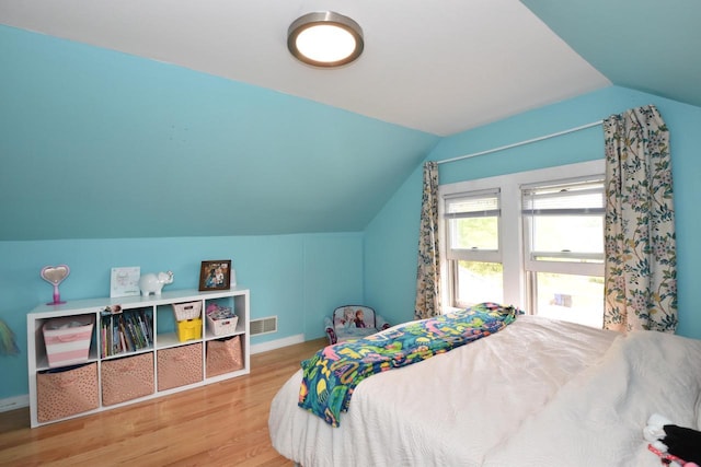 1032 Russet St, Racine, WI 53405 - bedroom featuring wood finished floors and vaulted ceiling