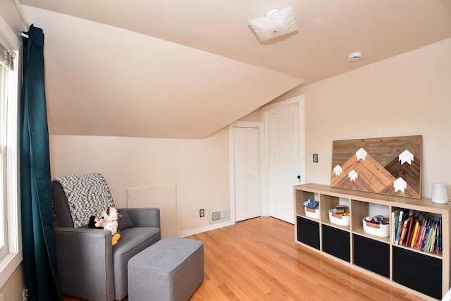 1032 Russet St, Racine, WI 53405 - sitting room with wood finished floors and lofted ceiling
