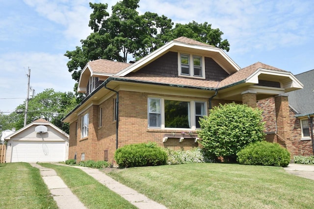 1032 Russet St, Racine, WI 53405 - view of front of home featuring brick siding, an outdoor structure, a detached garage, a front lawn, and roof with shingles
